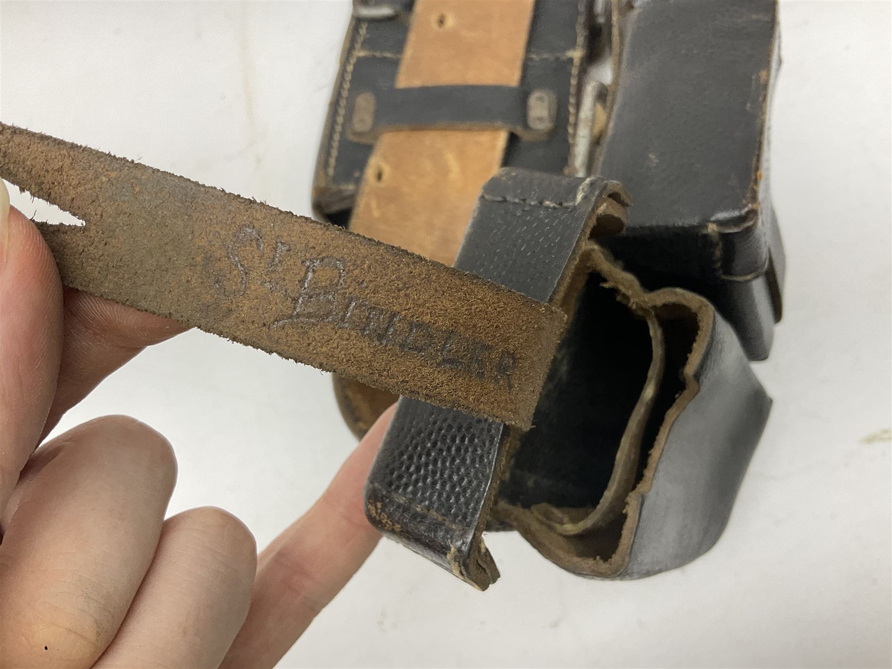 WW2 German 'SS' leather belt with six pouches (one containing unused field bandage) and buckle inscribed 'Meine Ehre Heifst Treue'; belt marked 0/0836 0029