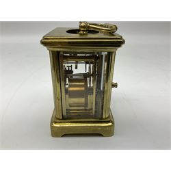 French brass framed carriage clock, the white dial with Roman numerals, with bevel glass panels and handle to top, H10cm