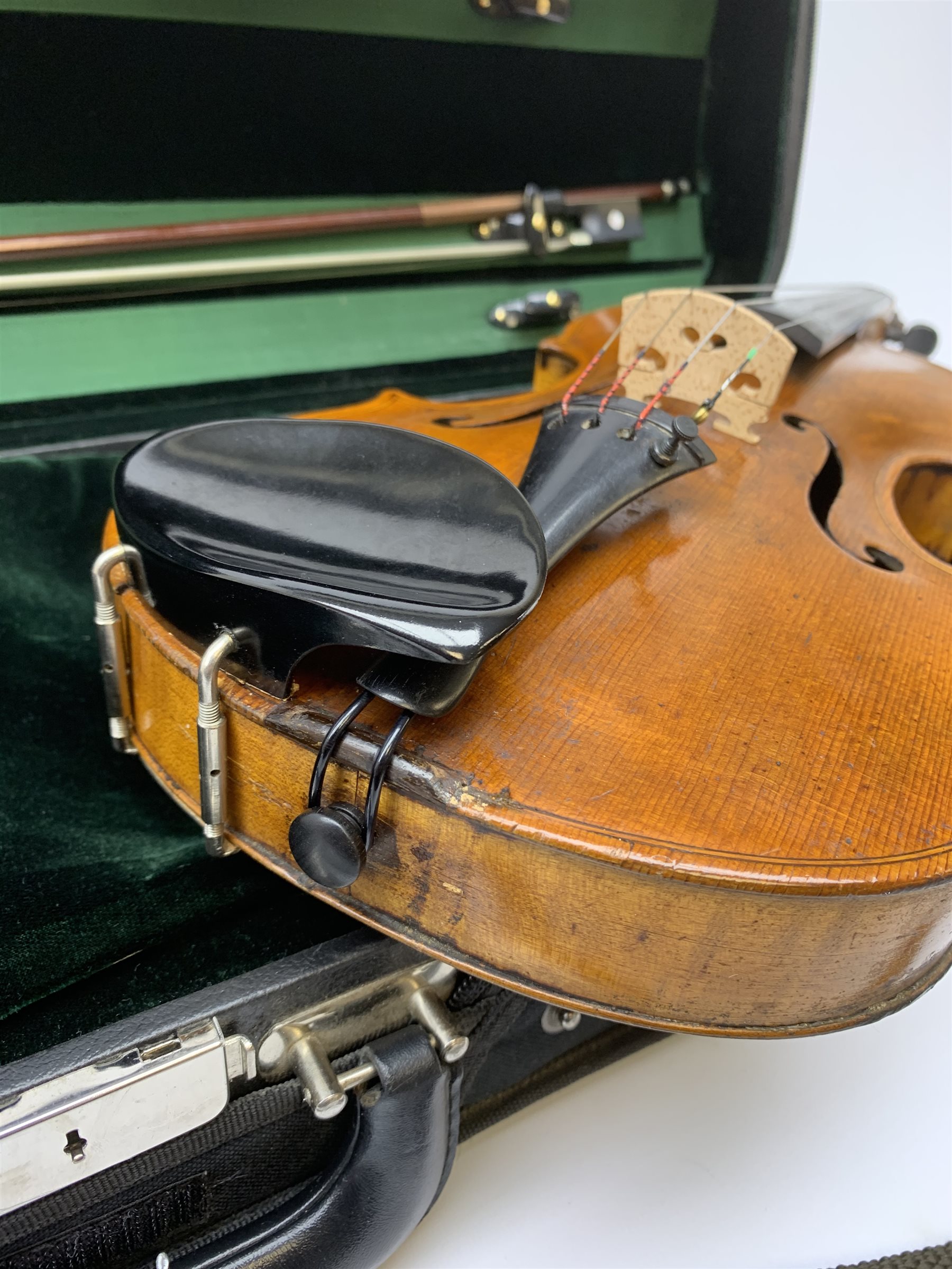 Late 19th century continental violin, possibly Italian, with 36cm two-piece maple back and ribs and spruce top, bears label 'Antonius Stradivarius Anno 1721', 60cm overall; in modern carrying case with silver mounted pernumbuco bow