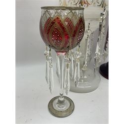 Bohemian red glass lustre, painted with stylised floral and foliate decoration, together with a milk glass example and two bohemian goblets converted to lustres 