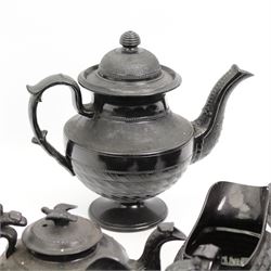 Early 19th century and later black basalt tea wares, mostly with relief or engine-turned bodies, including a Cyples bachelors teapot, other teapots, jugs etc in one box