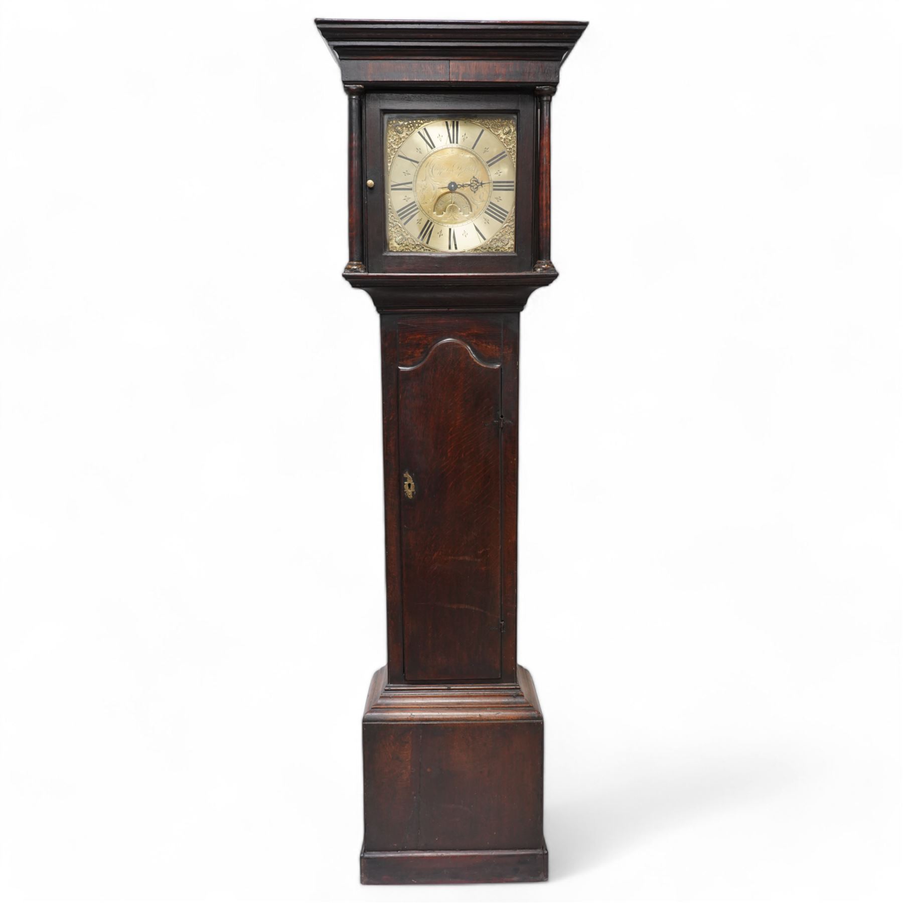 Cooper of Derby - Early 18th century 30hr oak longcase clock c1740, with a flat topped hood and plain frieze beneath, square hood door flanked by turned pilasters with wooden capitals, long trunk door with a wavy top on a square plinth with applied skirting, brass dial with cast spandrels and an engraved dial centre, chapter with Roman numerals, quarter hour markers, single steel hand and date aperture, chain driven countwheel striking movement, sounding the hours on a bell. With weight and pendulum.