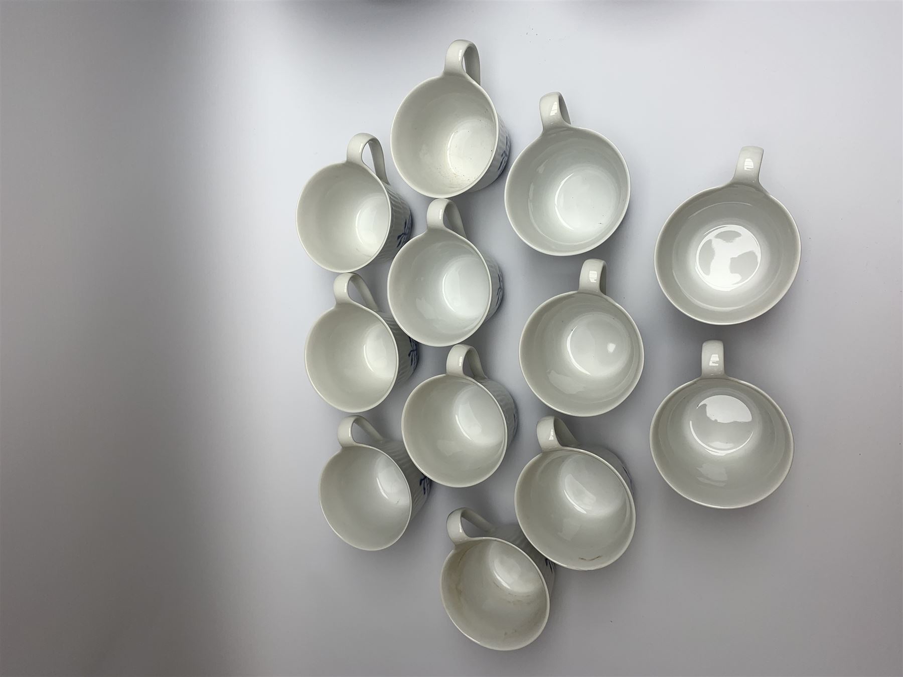 Royal Copenhagen tea and dinner service for twelve place settings, decorated in the Mega Blue Fluted pattern, pattern number 622, comprising dinner plates, salad plates, bowls with pierced rim, smaller bowls, tea cups, and saucers, dinner plates D27.5cm, salad plates D22cm