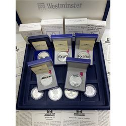 Nine commemorative coins relating to the France 1998 World Cup, some cased with certificates, in a blue coin storage box