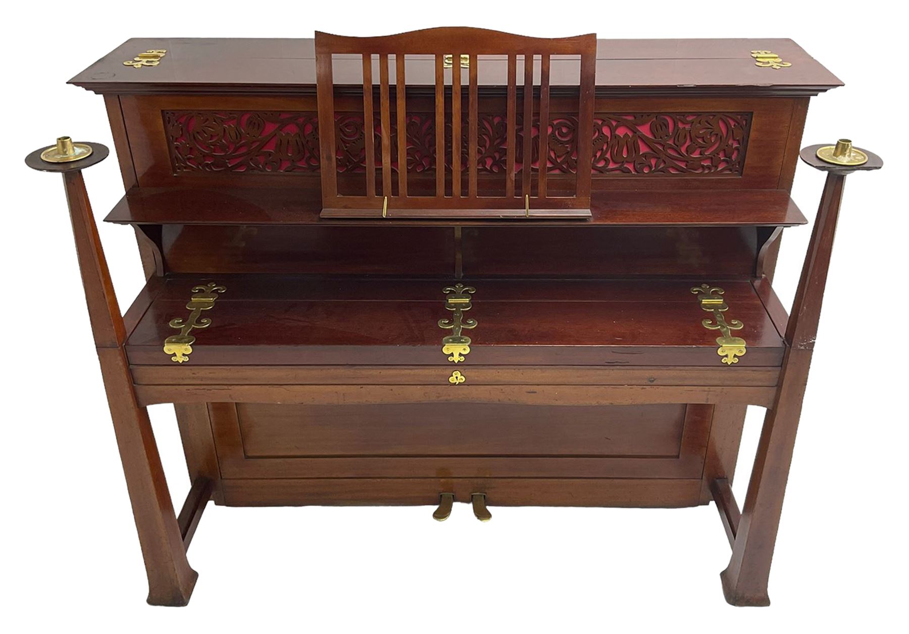 Carl Bechstein - late 19th century German overstrung upright piano, in a model 4 Arts and Crafts case designed by Walter Cave, with a lattice music desk and fretted silk backed front panel, brass hinged case lid and key fall with square tapered candle holders and circular sconces, iron frame, serial number 52187 (1899-1900), with an under damper action, 85 ebony and ivory keys, sustain and una corda pedals, original action, stringing, dampers, and action return straps, registered case number 328639, USA patent 24805.

This item has been registered for sale under Section 10 of the APHA Ivory Act