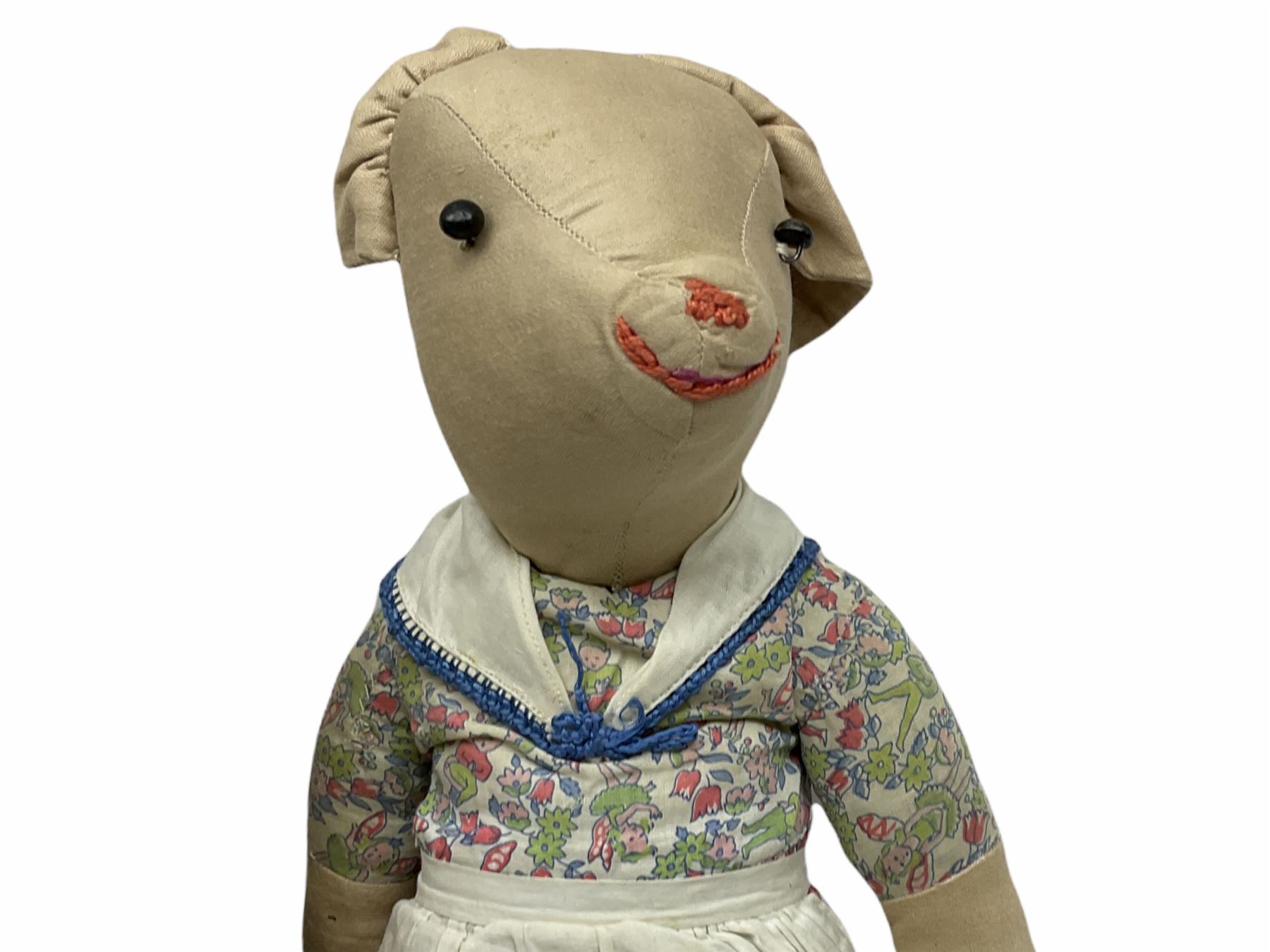 1950's teddy bear with jointed limbs, revolving head, wood filled body, stitched nose and mouth, applied glass eyes and foot pads, together with a quantity of handmade soft toy rabbits and penguins. 