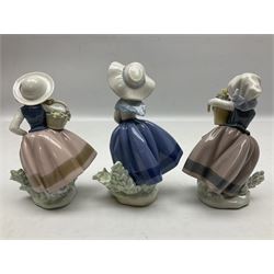 Three Lladro Flower Girls figures, comprising Sweet Scent no 5221, Pretty Pickings no 5222 and Spring is Here no 5223, largest example H18cm 