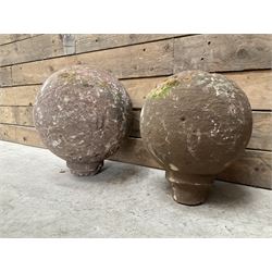 Two spherical stone gate post finials