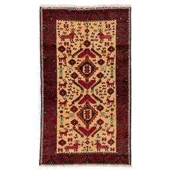 North East Persian Meshed Baluch rug, the ivory field decorated with two stepped diamond m...