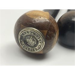 Two ebonised walking sticks, one with 'Leeds City Police' embossed top, tallest H92cm