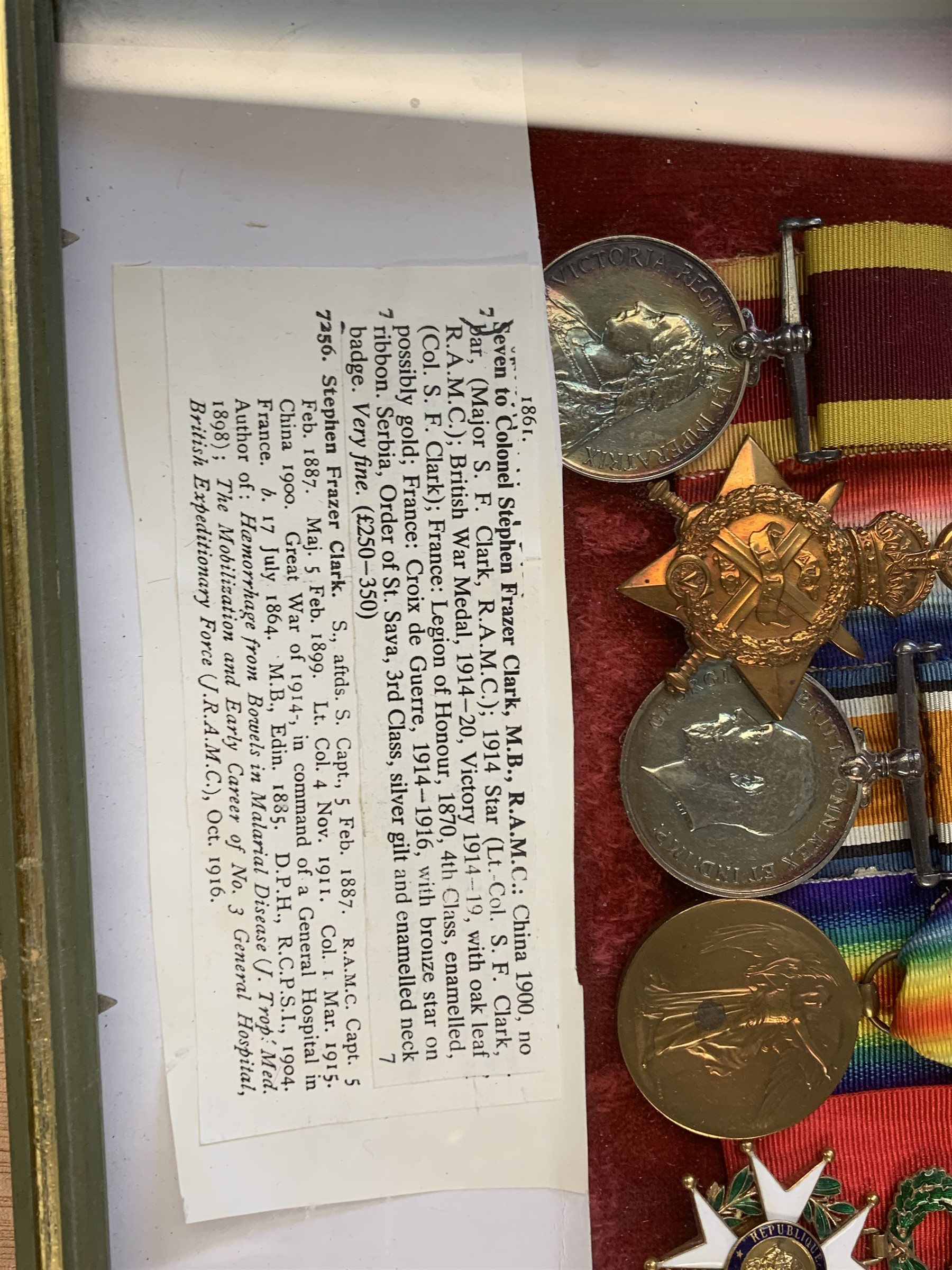 Group of seven medals/awards to Col. Stephen Fraser Clark M.B. R.A.M.C. comprising Victoria China 1900, no bar (Major S.F. Clark R.A.M.C.); 1914 Star (Lt.-Col. S.F. Clark R.A.M.C.); British War Medal 1914-20 and Victory Medal 1914-19 with oak leaf (Col. S.F. Clark); French Legion of Honour 1870 4th class enamelled; French Croix de Guerre 1914 -1916 with bronze star on ribbon; and Serbian Order of St. Sava 3rd Class silver gilt and enamelled neck badge; framed with some biographical information