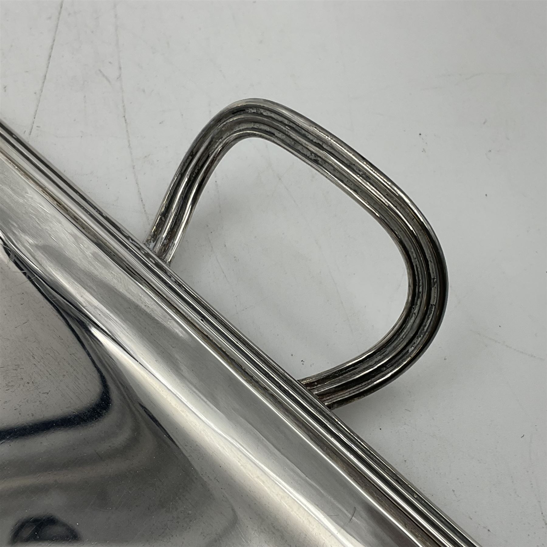 Small early 20th century silver tray, of rectangular form with reeded edge and twin reeded handles, hallmarked Asprey & Co Ltd, London 1914, including handles W26.5cm