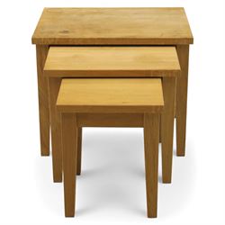 Modern solid oak nest of three tables, each with straight-edged rectangular top and square legs