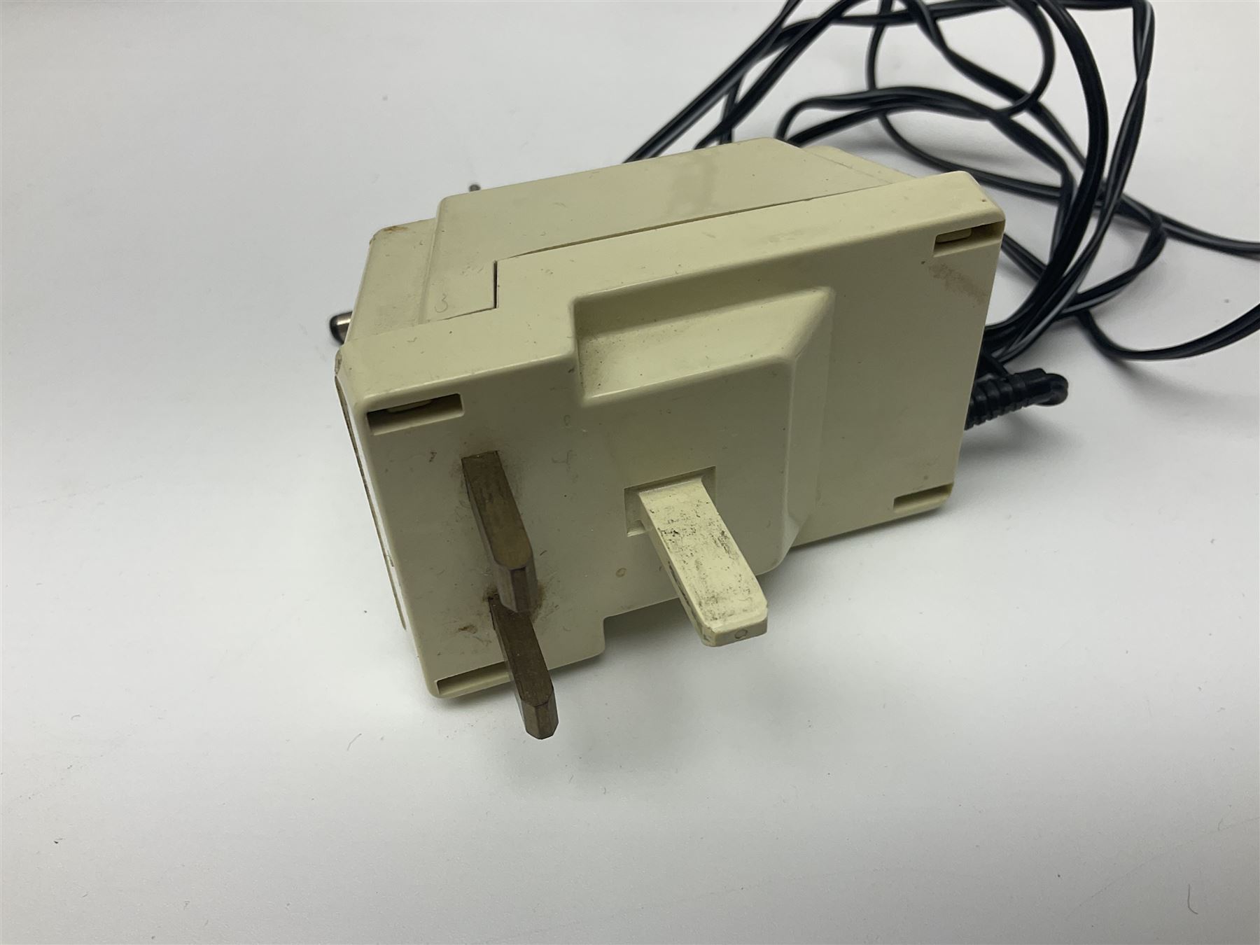 Sinclair ZX Spectrum (1984) with accessories and games; ten games for Sinclair Spectrum and 48K Spectrum to include ‘Knight Lore’, ‘The Way of the Exploding Fist’, and ‘Green Beret’ all in original boxes, ‘Rambo First Blood Part II’ without original box; Sinclair UK1400 Power Supply Unit, Hales Universal Mains Adapter, RAM Turbo Spectrum Joystick Interface, Starlite Cassette Player, all without boxes