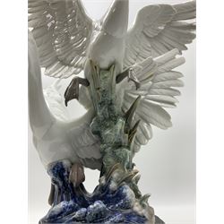 Large Lladro figure group, Swans Take Flight, modelled as two swans upon raised on circular wooden plinth, sculpted by Salvador Debon, H68cm
