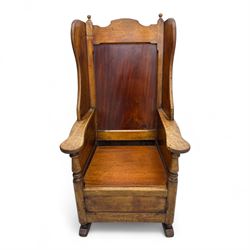 19th-century beech, yew, elm, and mahogany wingback vernacular rocking chair, high back with shaped wings, scroll arms with turned supports, lift-up seat,  square legs on ring turned supports on curved runners 