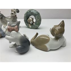 Five Lladro figures, comprising Puppy no 8071, Unexpected visit no 6829, Cat and Mouse no 5236, Surprised Cat no 5114 and Ducks no 4895
