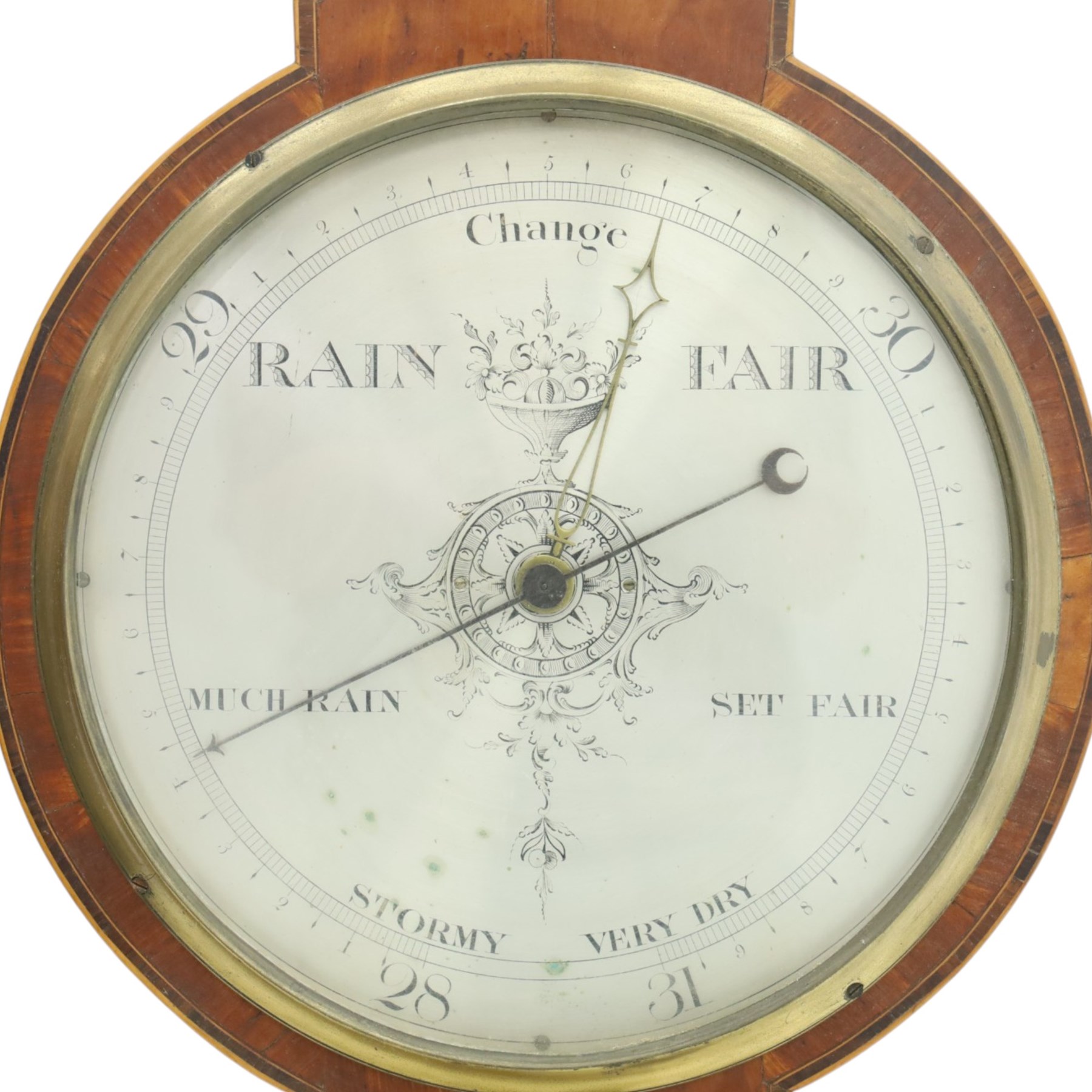 Three mahogany wheel barometers, each with silvered dial, thermometer and hygrometer, two with inlaid decoration, one with architectural pediment and one with swan-neck pediment 