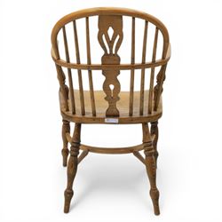 Late 20th century elm and beech low back country Windsor armchair, the arched hoop back with central pierced splat and turned spindles, shaped arm rail on turned supports, saddle seat, raised on turned legs united by a crinoline stretcher