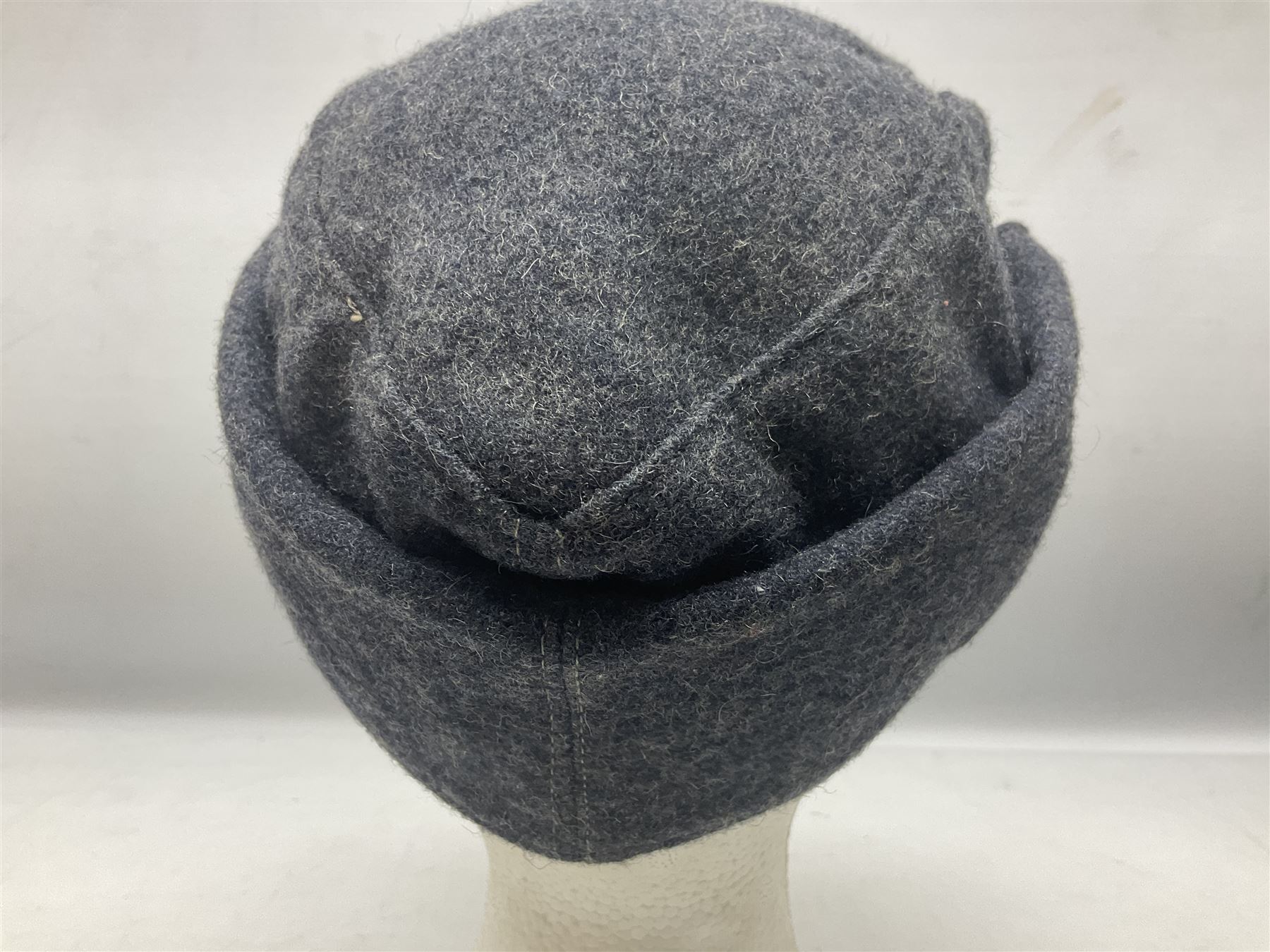 WW2 German Luftwaffe M43 field cap with triangular cloth eagle and roundel badge; marked '1944 ?/0501/0015 57'