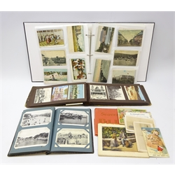  Three albums containing over four hundred and eighty Edwardian and later postcards including real photographic and printed topographical, comic, WW1 shipping, etc and a view album of Blida  