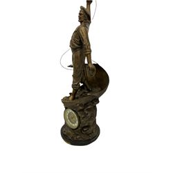 An imposing bronzed spelter clock depicting a 19th century  fisherman, on a circular ebonised base with a plaque entitled “Cod Fishing” with a Parisian eight-day striking movement striking the hours and half-hours on a coiled gong, two-part dial with a gilt centre, ivorine chapter inscribed with upright gothic Arabic numerals and minute markers, with steel gothic hands within a brass bezel and flat bevelled glass. With pendulum.   



