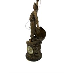 An imposing bronzed spelter clock depicting a 19th century  fisherman, on a circular ebonised base with a plaque entitled “Cod Fishing” with a Parisian eight-day striking movement striking the hours and half-hours on a coiled gong, two-part dial with a gilt centre, ivorine chapter inscribed with upright gothic Arabic numerals and minute markers, with steel gothic hands within a brass bezel and flat bevelled glass. With pendulum.   



