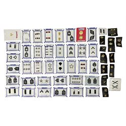 Fifty US rank badges and trade badges; WW2 and Vietnam period; predominantly on sale cards