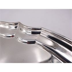 Modern silver salver, with shaped pie crust rim, upon four scroll feet, hallmarked L R Watson, Sheffield 1997, D21cm