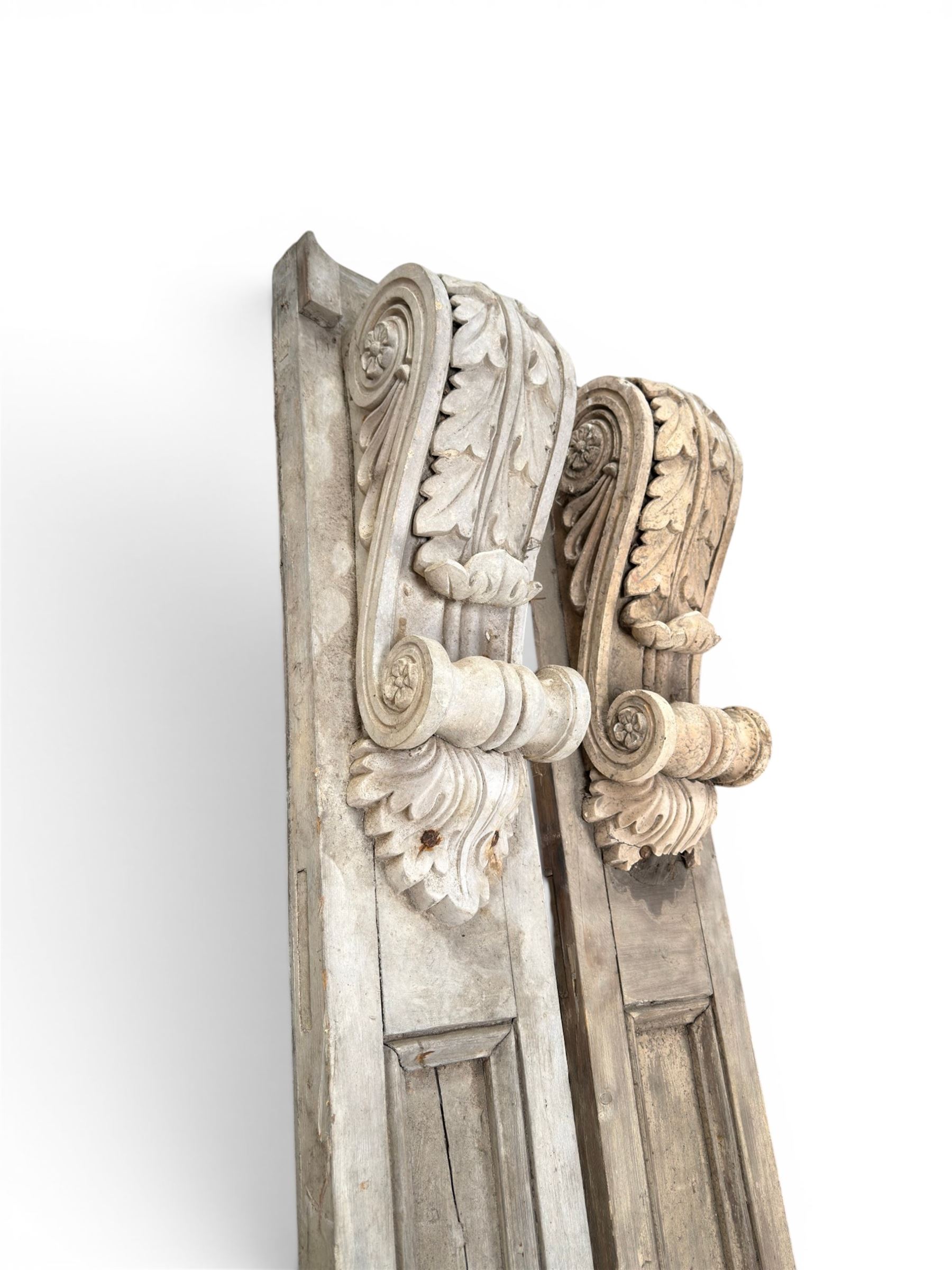 Pair of 19th century pine architectural pilasters, with painted terracotta capitols, with acanthus and scroll detail (18cm x 15cm x 57cm)