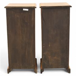 Traditional walnut inlaid pair of tall bedside chests, figured top with inlaid banding, four graduating drawers with wooden turned knobs, raised on a plinth  