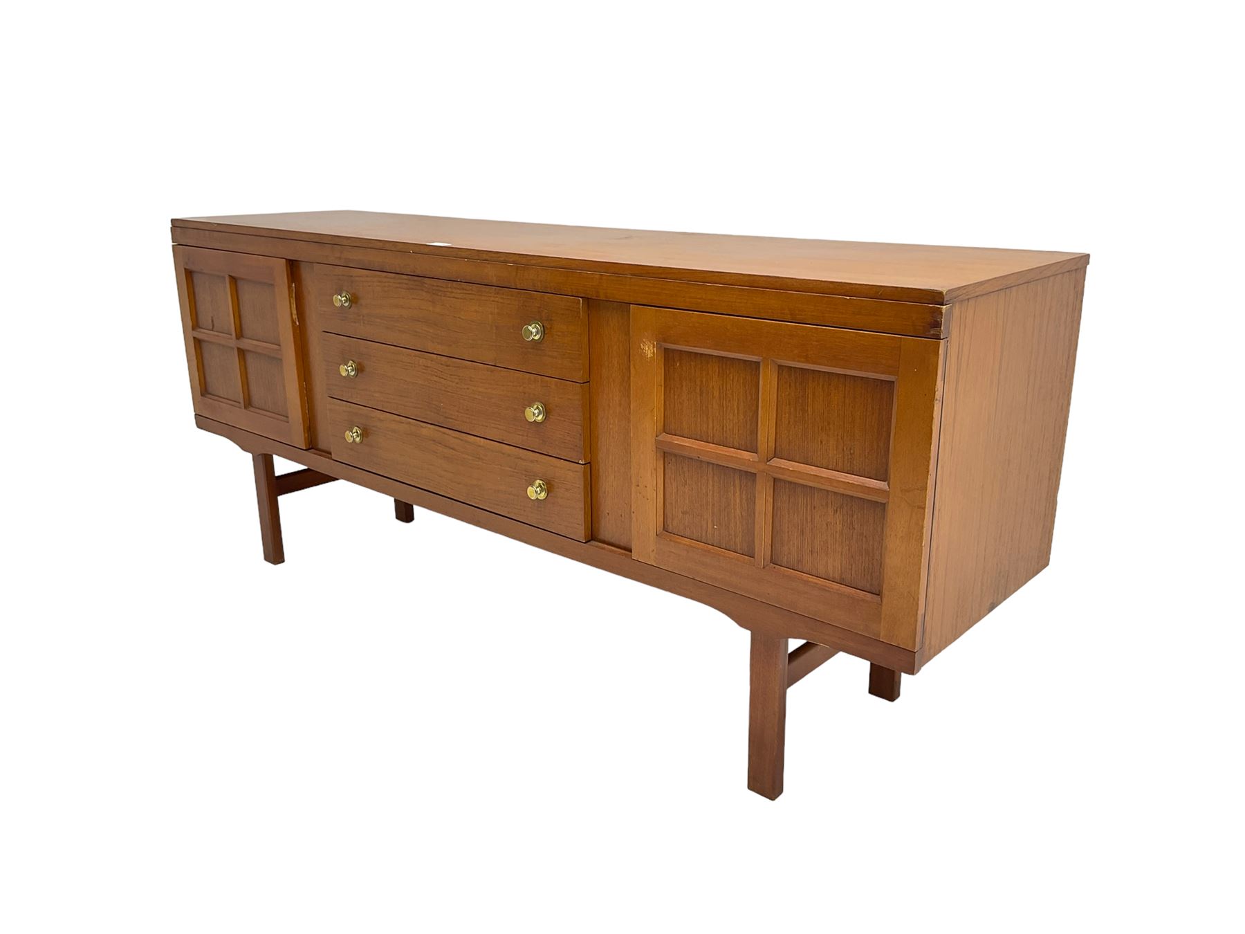 Elliotts of Newbury (EoN) - mid-20th century teak sideboard, fitted with three central drawers flanked by two cupboards, raised on square supports 