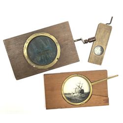 Two wood framed hand cranked rack and pinion chromatrope glass magic lantern slides, and a lever animated magic lantern slide depicting a galleon in a rough sea (3)