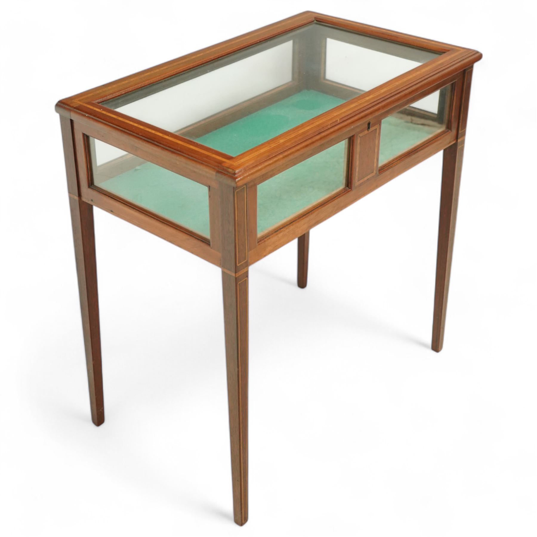 Edwardian satinwood and inlaid bijouterie table, rectangular hinged glazed top above a baize-lined interior, frieze with panelled inlay detail, raised on square tapered legs with boxwood and ebony stringing