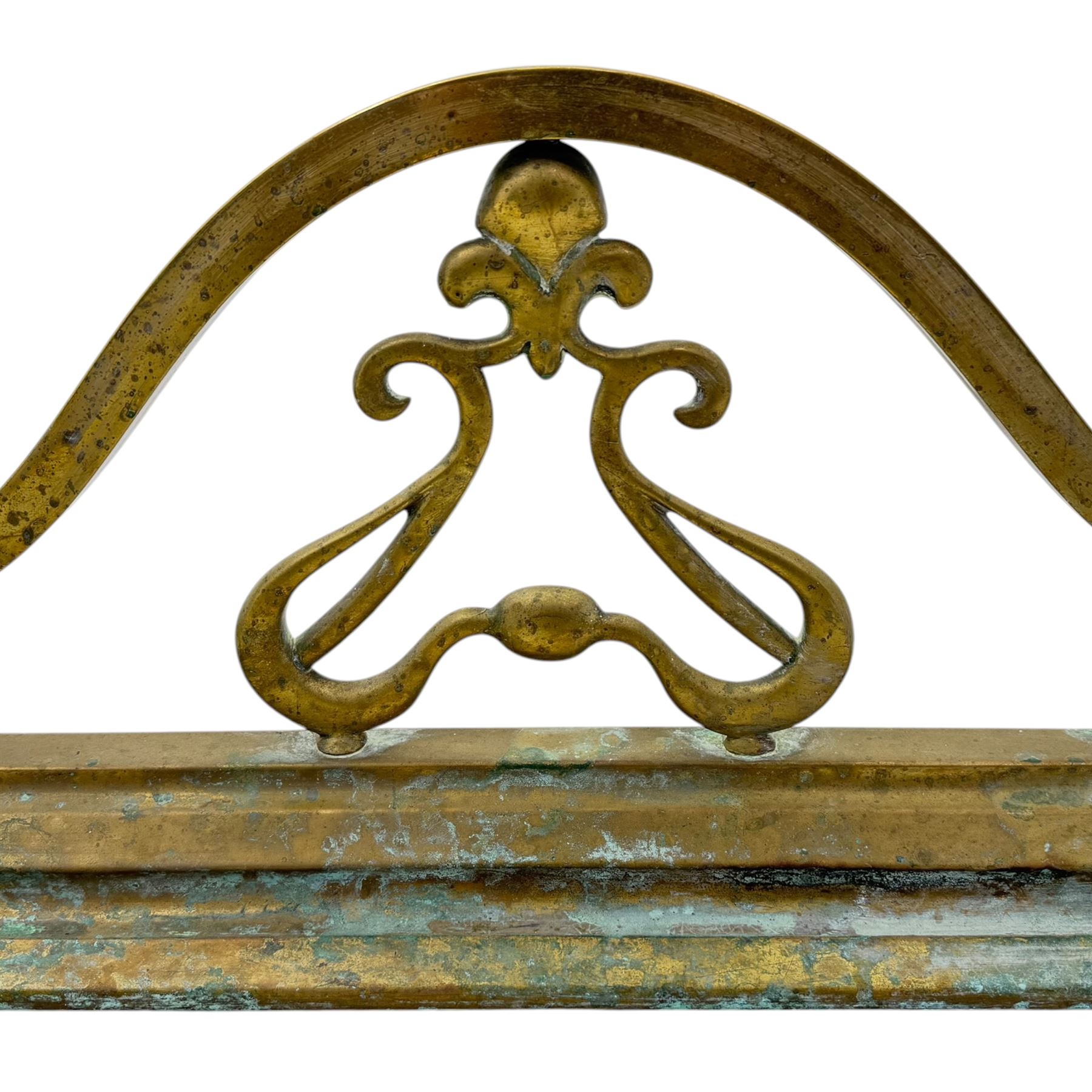 Three 20th century brass fenders, two with pierced Art & Crafts design rails, largest W156cm, D 45cm 