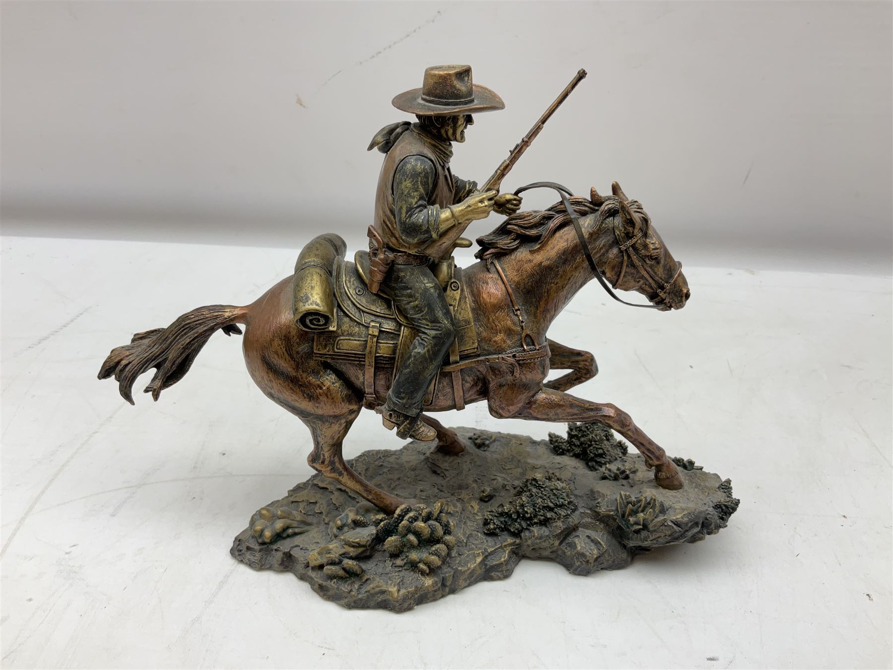The Bradford Exchange John Wayne bowie decorative knife, L27cm and John Wayne Tall in the Saddle Galloping Thunder figure group