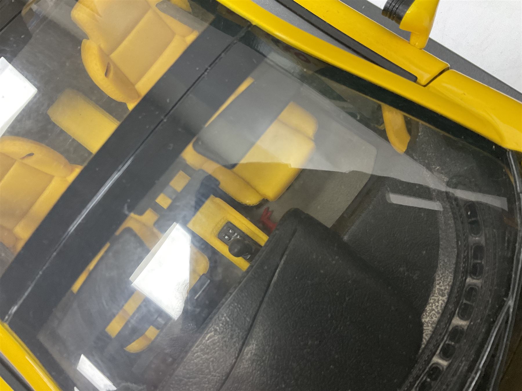 Two Maisto 1:12 scale Jaguar XJ220 ‘Racing’ cars in yellow, both on plinths in original boxes 