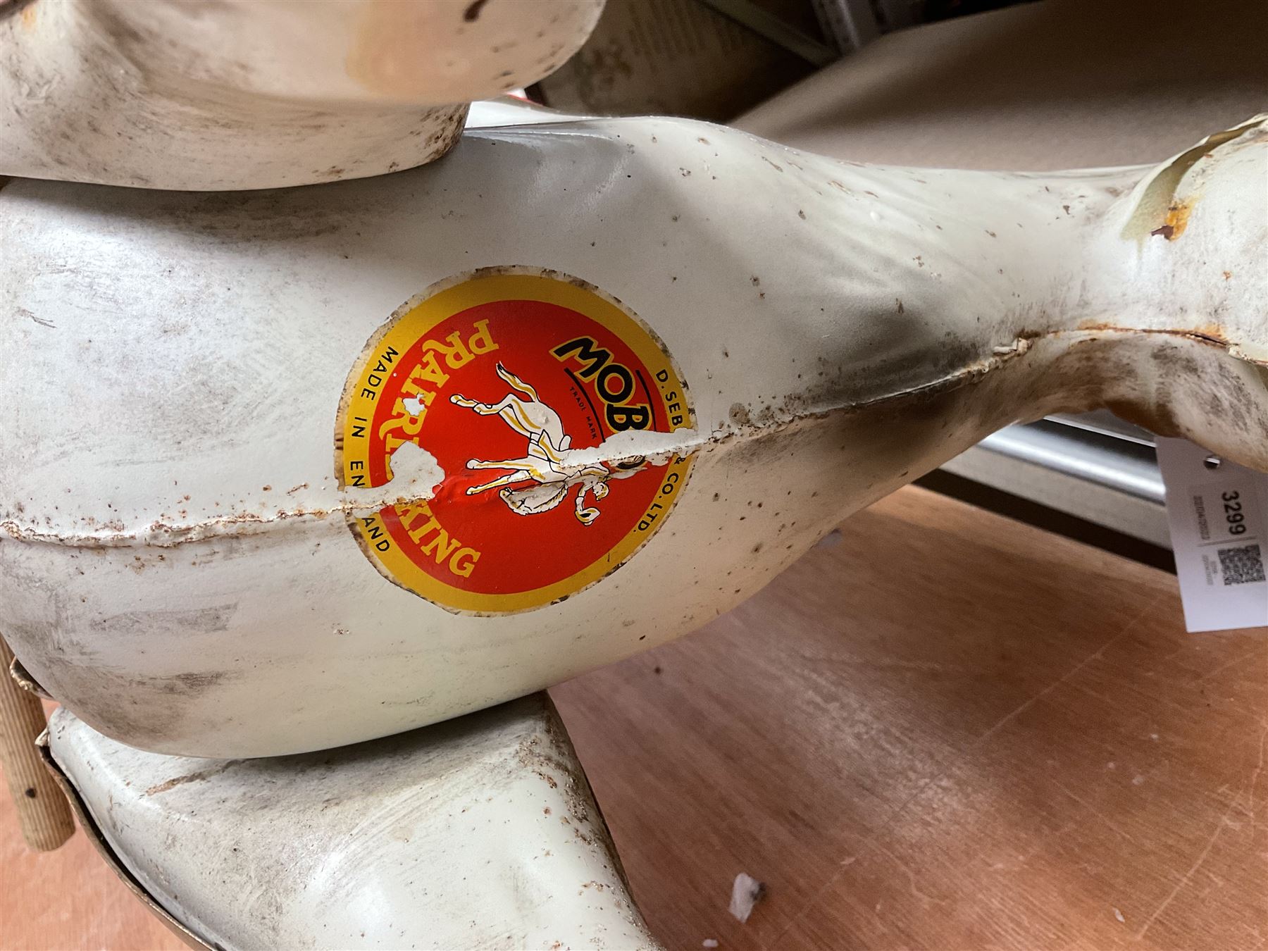 1960's Mobo Toys (David Sebel & Co) Prairie King spring rocking horse on stand, painted pressed steel construction, red tubular stand, trademark red and yellow circular Mobo logo, 100cm long (dismantled)