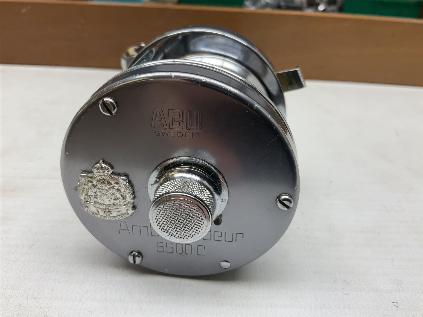 Four Abu fishing reels, comprising Ambassadeur 9000, Ambassadeur 7000, Ambassadeur 5500 and Ambassadeur 6500, together with additional line, hardy fishing bag and two wooden boxes