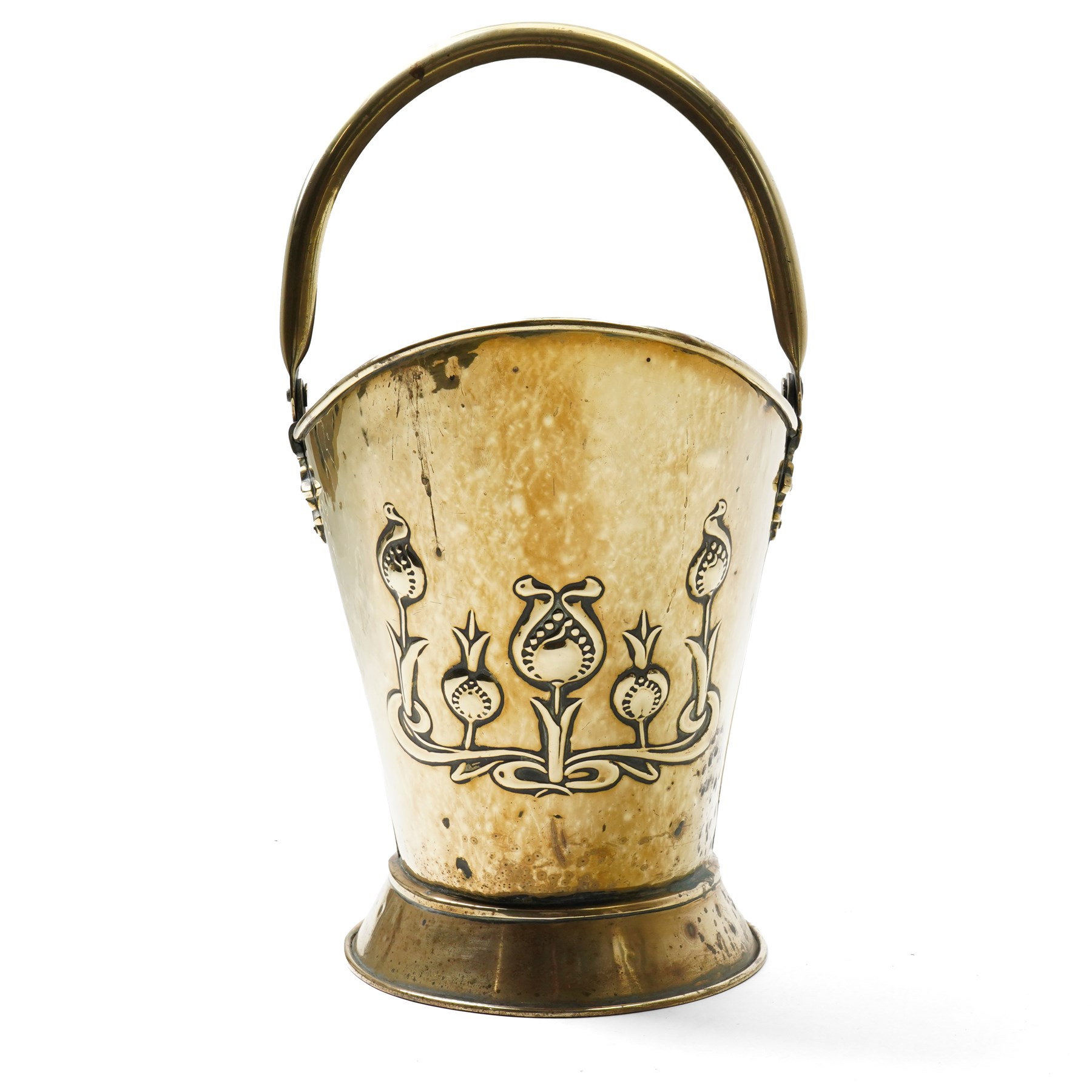 Art Nouveau brass log bucket of oval design with swing handle and a raised pattern of stylised flowers H29cm
