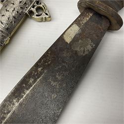 Moroccan jambiya dagger with 24.5cm plain curved blade stamped LONDON to the ricasso area, the hilt and scabbard overlaid with plain sheet brass to the back and ornate silver coloured metal to the front; waisted grip and arched pommel; two pyramid mounts to the scabbard L41cm overall; large billhook with curving blade and stacked leather washer grip; and a reproduction halberd blade (3)