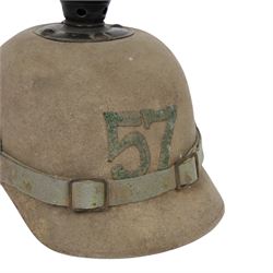 WWI Prussian 57th regiment Ersatz felt Pickelhaube, the grey felt skull with steel spike finial, stitched with green felt 57, chin strap, one side with a black cockade, the other black and red
