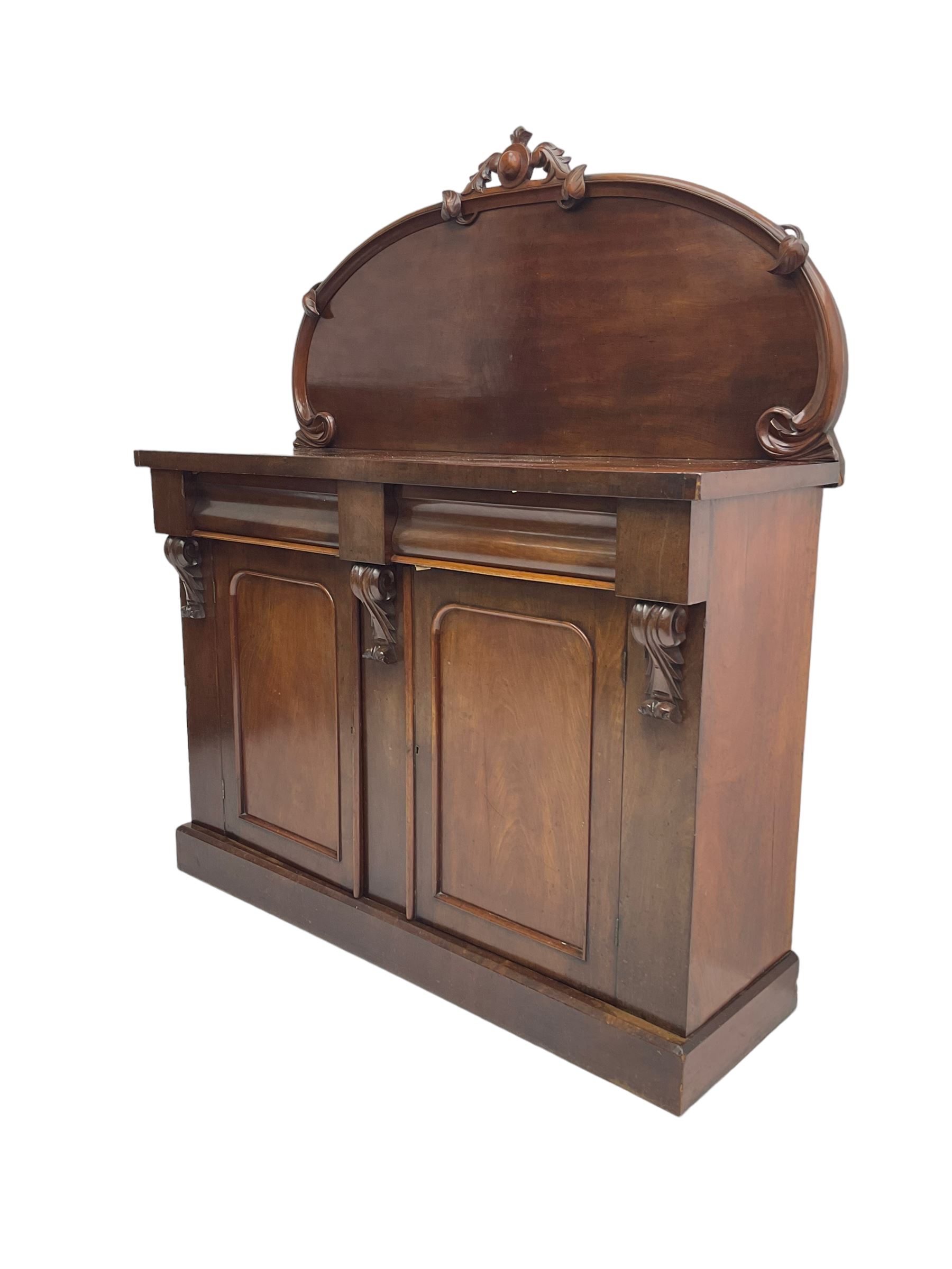 Victorian mahogany chiffonier sideboard, raised back with central cartouche pediment, fitted with two two drawers over two panelled cupboards, flanked by foliate corbels