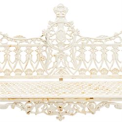 Victorian revival heavy cast iron garden bench, ornate back rest with scrolls, floral motifs and central crest, pierced lattice seat, curved arms and decorative legs, painted in antique white, in the Gothic Coalbrookdale style