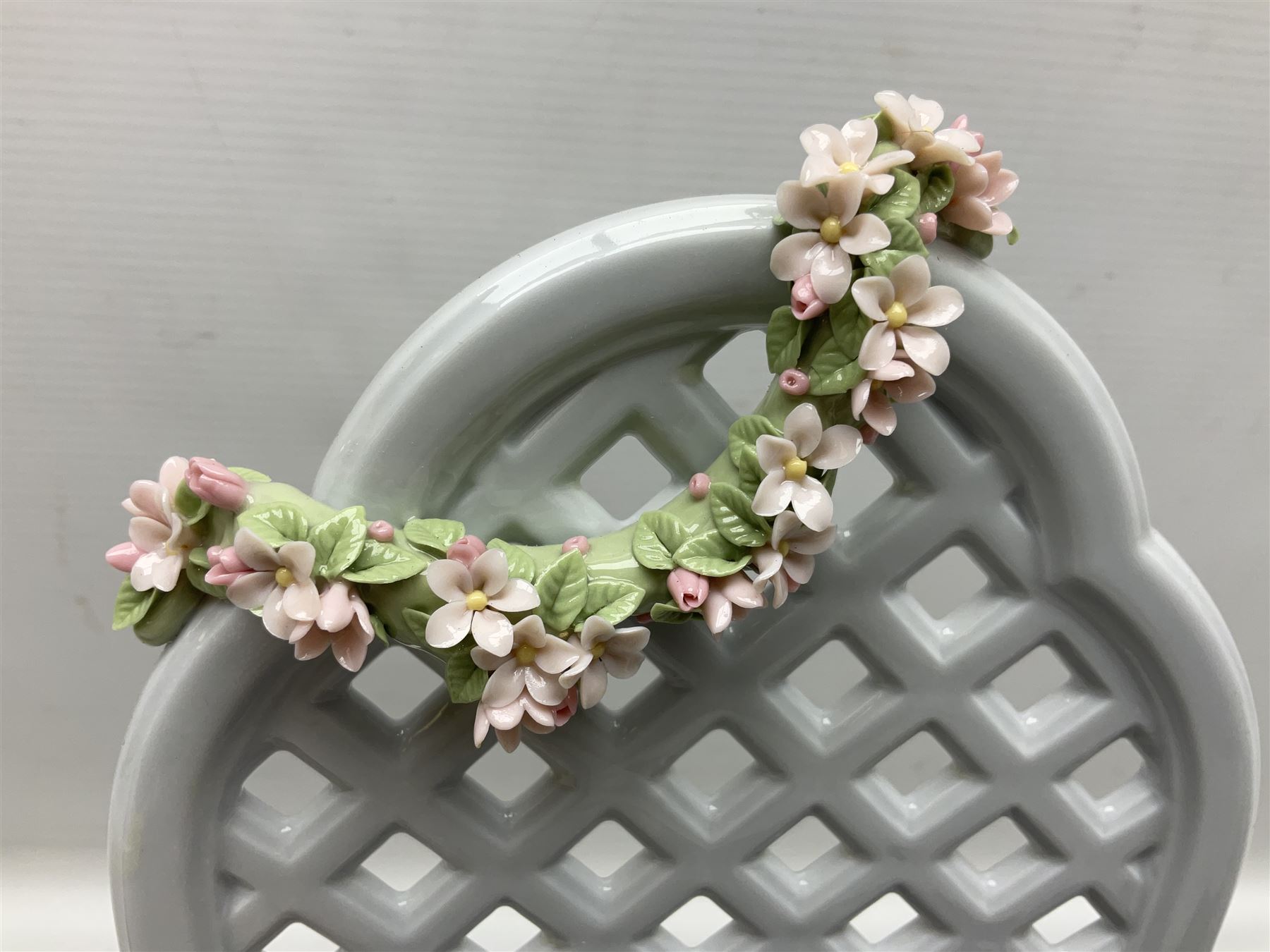 Lladro figure, Garden of Dreams, modelled as a woman reclining in front of trellis of flowers on a mahogany base, limited edition 3129/4000, sculpted by  José Puche, with original box, no 7634, year issued 1994, year retired 1996, H32cm