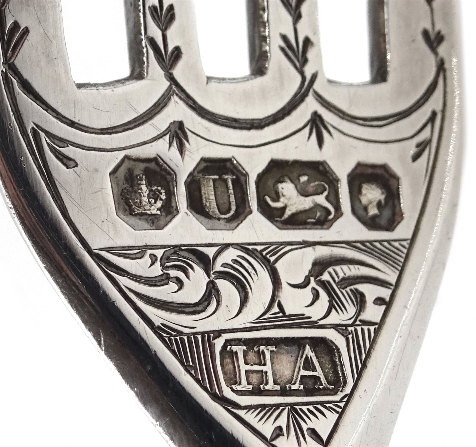 Victorian silver lidded trinket box, with embossed decoration by John Edward Wilmot, Birmingham 1900, silver bladed knife and fork with mother of pearl handles by Atkin Brothers, Sheffield 1862 and an embossed silver dish hallmarked (4)