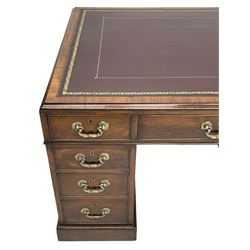 George III mahogany twin pedestal partner's desk, moulded rectangular caddy top with tooled leather inset, one side fitted with nine drawers and the opposing side fitted with single drawer, two false drawers and two panelled cupboards, ornate cast gilt metal handles and handle plates, on plinth base