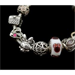 Silver Pandora bracelet with four Disney charms including Minnie Mouse, Simba and Nala from The Lion King, and Tigger from Winnie the Pooh, with eight other silver Pandora charms, in Pandora box