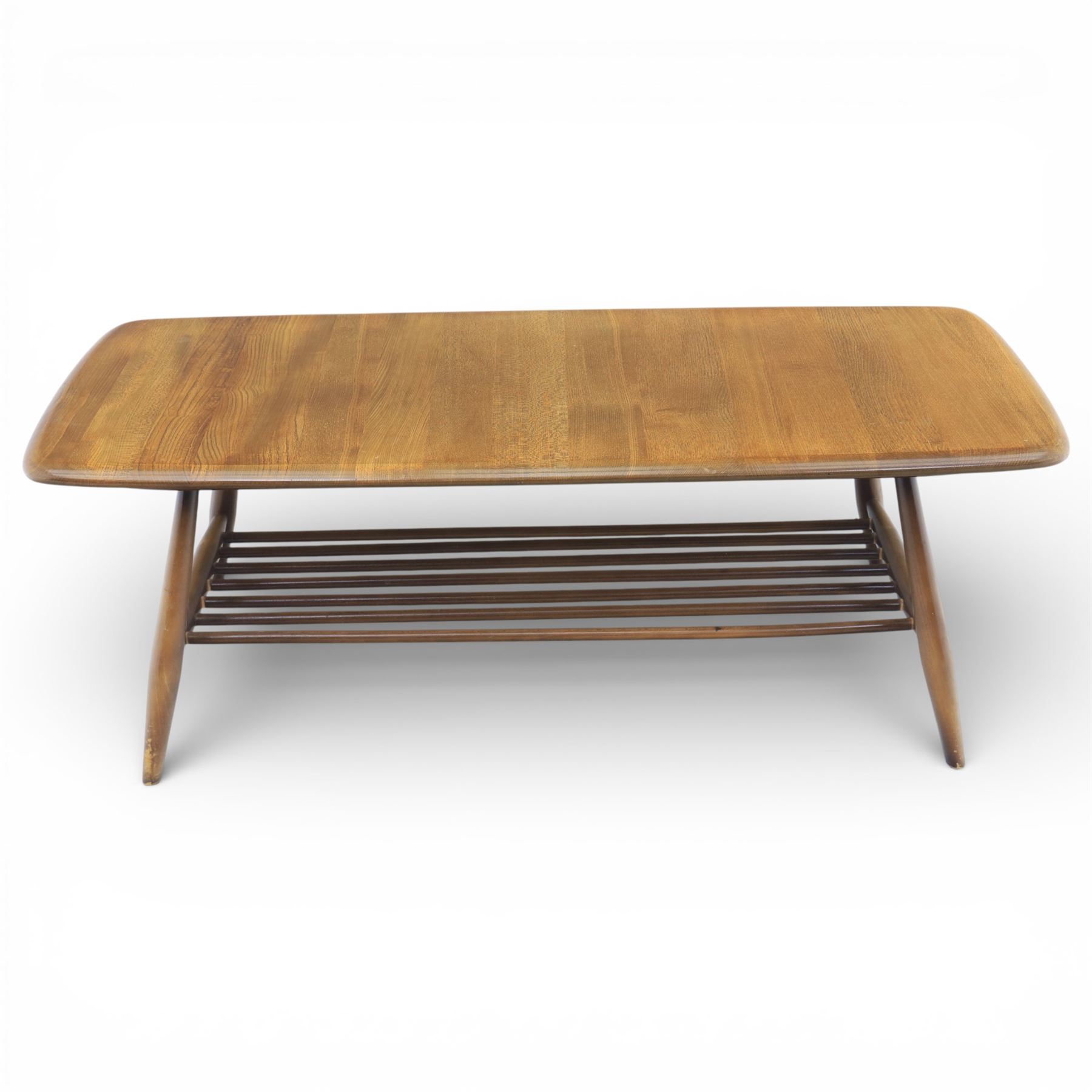 Ercol - Dark elm coffee table, plank top with chamfered edges, over a central under tier spindles, tapered legs 
