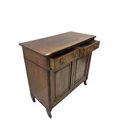 Regency period mahogany side cabinet, rectangular top over two drawers and panelled double cupboard, horizontal and vertical reeded uprights, on splayed sabre feete